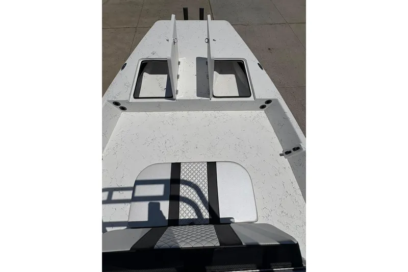 Slide: The Image of 2026 Freedom Boats 21' Commander deck with storage compartments and seating. - 6