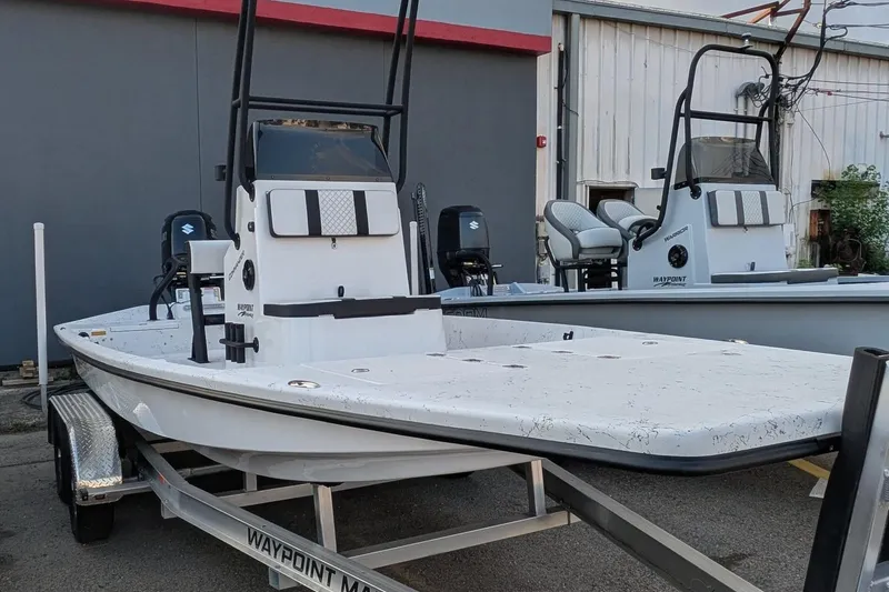 The Image of 2026 Freedom Boats 21' Commander on trailer, sleek design, ready for adventure. - 1