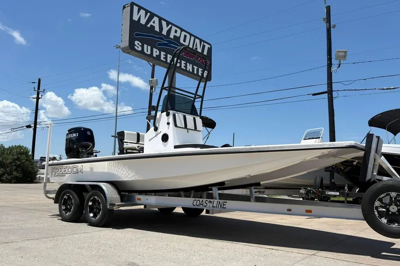 Slide: The Image of 2026 Freedom Boats 21' Commander on trailer at Waypoint Supercenter. - 17