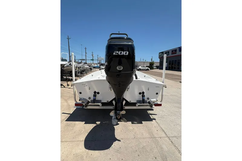 Slide: The Image of 2026 Freedom Boats 21' Commander with powerful 200 HP engine, rear view. - 18