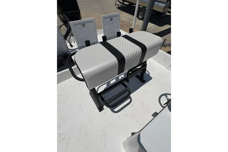Slide: The Image of 2026 Freedom Boats 21' Commander seat with black and gray design on deck. - 7