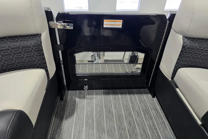 Slide: The Image of 2026 Premier 230 Intrigue GT RLO pontoon boat in a garage setting. - 10