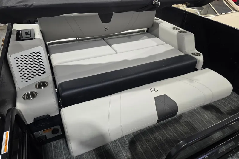 Slide: The Image of Interior of 2026 Premier 230 Intrigue GT RLO boat with modern helm and seating. - 18