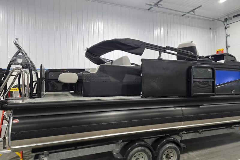 Slide: The Image of Interior of 2026 Premier 230 Intrigue GT RLO boat with modern steering and controls. - 19