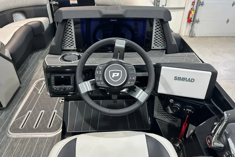 Slide: The Image of Steering console of 2026 Premier 230 Intrigue GT RLO boat with Simrad display. - 20