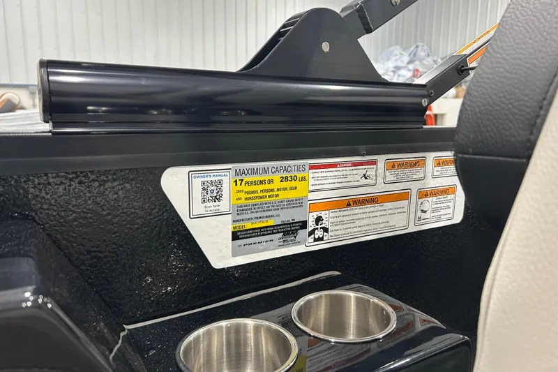 Slide: The Image of 2026 Premier 230 Intrigue GT RLO boat capacity label and cup holders. - 21