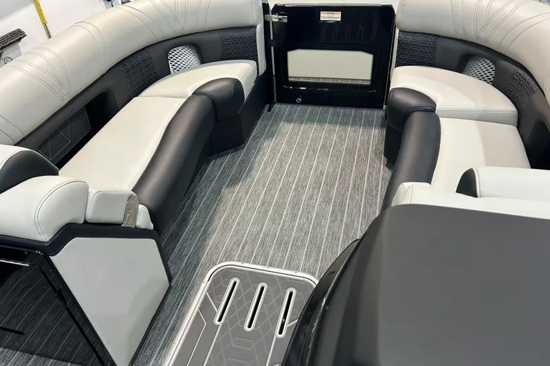 Slide: The Image of Luxurious interior of 2026 Premier 230 Intrigue GT RLO pontoon boat with plush seating. - 25