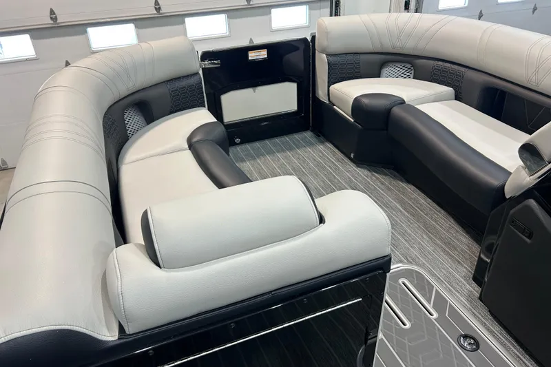 Slide: The Image of Luxurious interior of 2026 Premier 230 Intrigue GT RLO pontoon boat with plush seating. - 27
