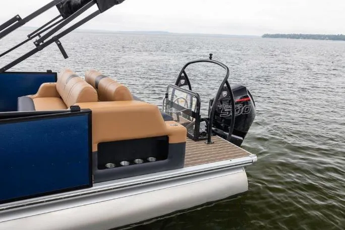 Slide: The Image of 2026 Premier 230 Intrigue GT RLO pontoon boat in a showroom setting. - 3