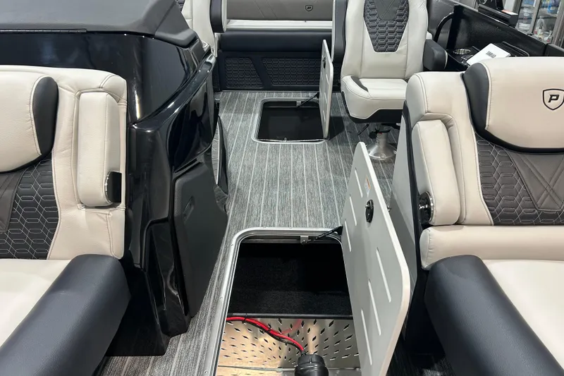 Slide: The Image of 2026 Premier 230 Intrigue GT RLO boat interior with luxurious seating and storage compartments. - 30
