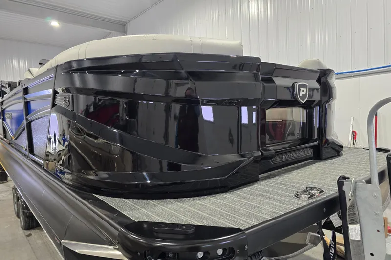 Slide: The Image of Close-up of 2026 Premier 230 Intrigue GT RLO boat corner with sleek design and integrated lights. - 5