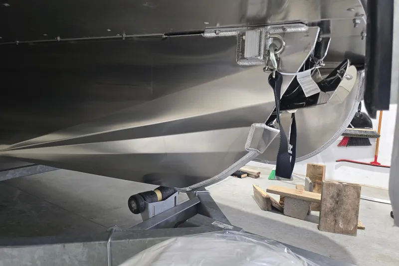 Slide: The Image of 2026 Premier 230 Intrigue GT RLO pontoon boat in a garage setting. - 7