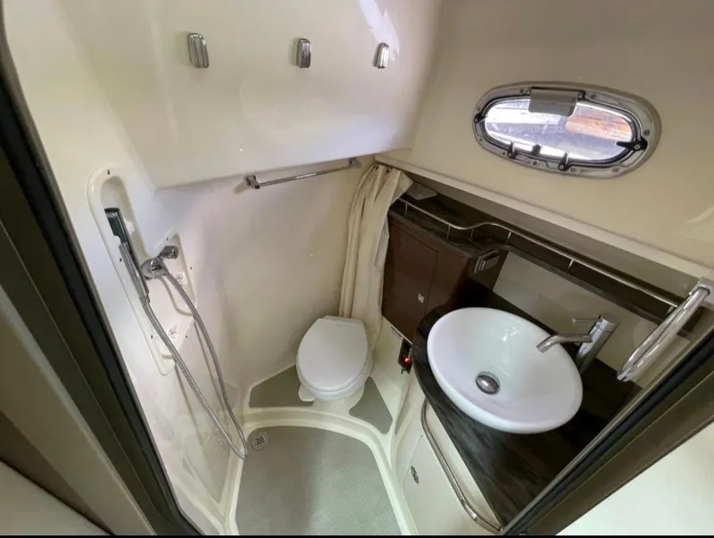 Slide: The Image of 2019 Boston Whaler 345 Conquest bathroom with shower, sink, and toilet. - 17