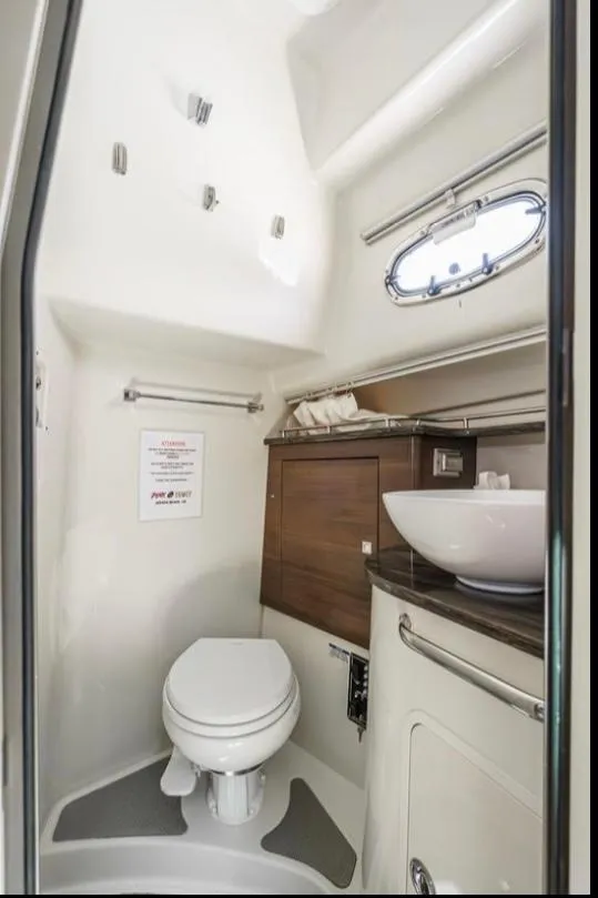Slide: The Image of 2019 Boston Whaler 345 Conquest bathroom with modern fixtures and compact design. - 19