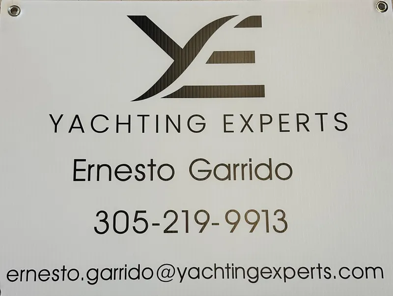 Slide: The Image of Yachting Experts contact sign with email and phone number for inquiries about Boston Whaler 345 Conquest. - 22