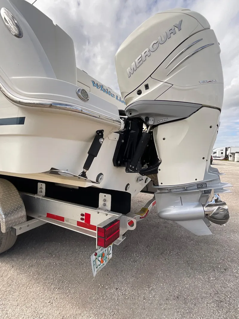 Slide: The Image of 2019 Boston Whaler 345 Conquest with Mercury outboard engine on trailer. - 5