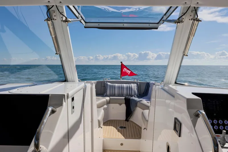 Slide: The Image of 2026 MJM 38x yacht interior with ocean view, featuring sleek design and comfortable seating. - 14
