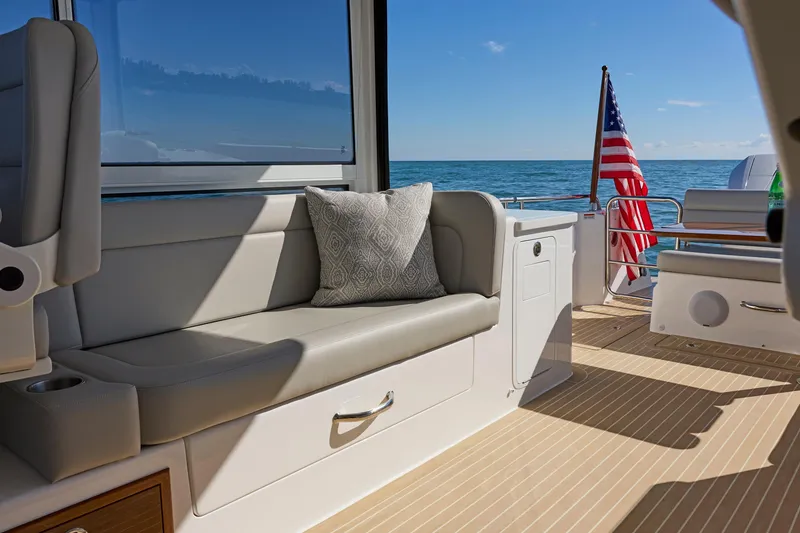 Slide: The Image of Luxurious 2026 MJM 38x yacht interior with ocean view and American flag. - 23
