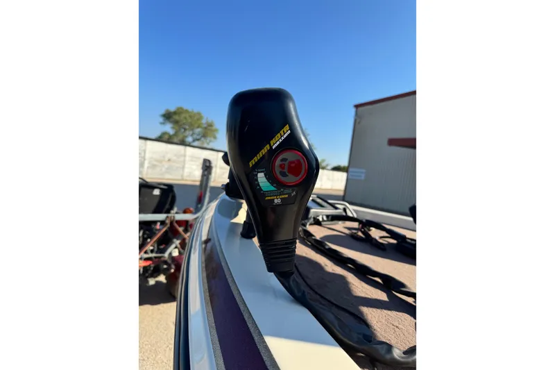 Slide: The Image of 2006 Skeeter SX200 boat with Minn Kota trolling motor, outdoor setting. - 6