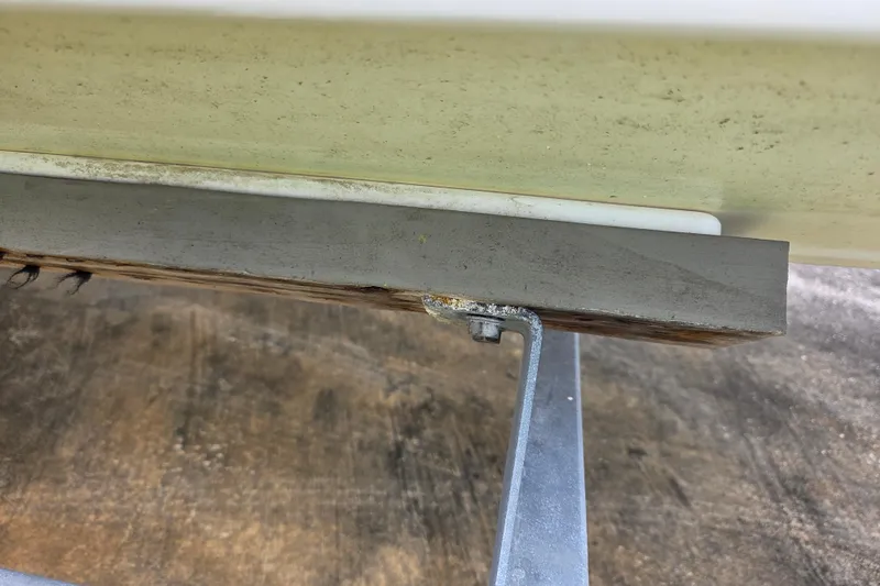 Slide: The Image of Close-up of 2023 Mako Pro Skiff 19 CC boat hull on trailer. - 12