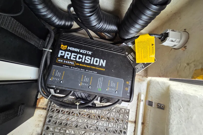 Slide: The Image of Minn Kota Precision MK 345PCL on-board battery charger in 2023 Mako Pro Skiff 19 CC. - 25