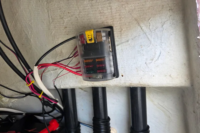 Slide: The Image of Electrical fuse box in a 2023 Mako Pro Skiff 19 CC boat. - 28