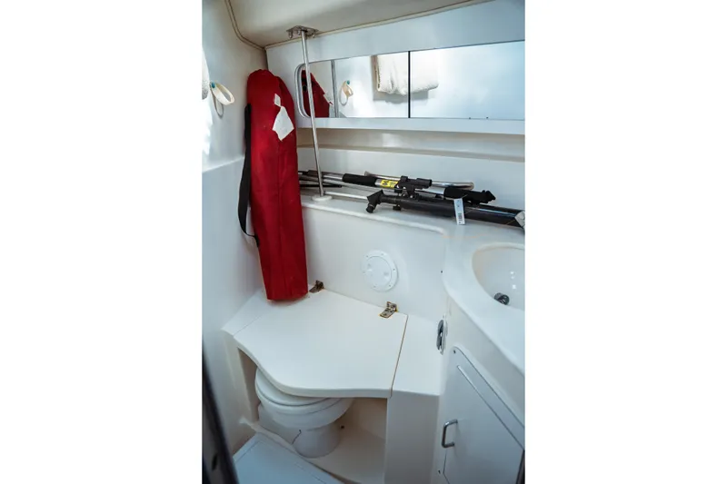 Slide: The Image of 1994 Catalina 38 CC yacht bathroom with toilet, sink, and storage. - 16