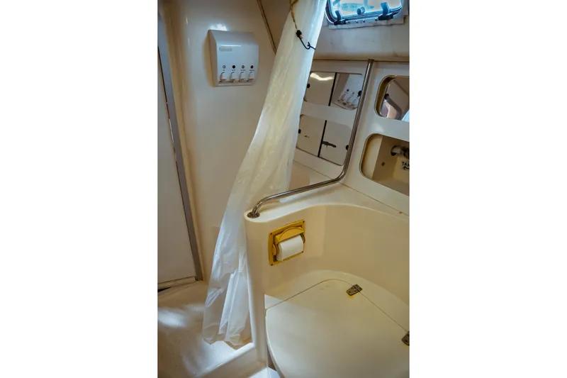 Slide: The Image of Bathroom interior of 1994 Catalina 38 CC yacht, featuring shower and storage compartments. - 22