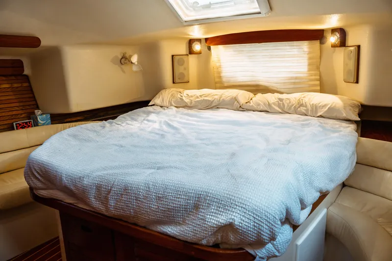 Slide: The Image of Cozy cabin interior of 1994 Catalina 38 CC sailboat with comfortable bed and soft lighting. - 26