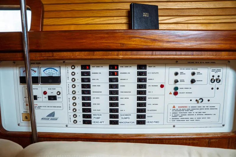 Slide: The Image of Control panel of a 1994 Catalina 38 CC sailboat with various switches and gauges. - 34