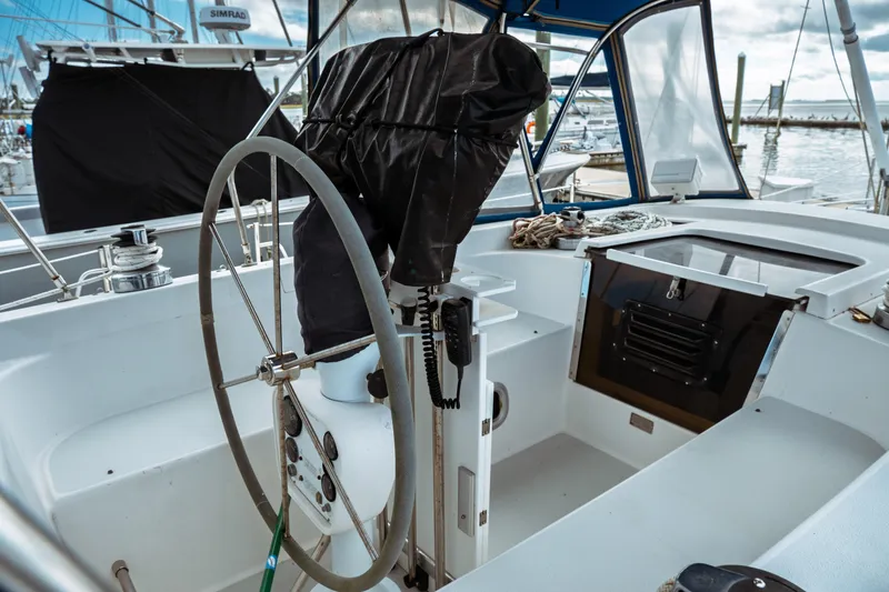 Slide: The Image of Cockpit of 1994 Catalina 38 CC sailboat with steering wheel and navigation equipment. - 8