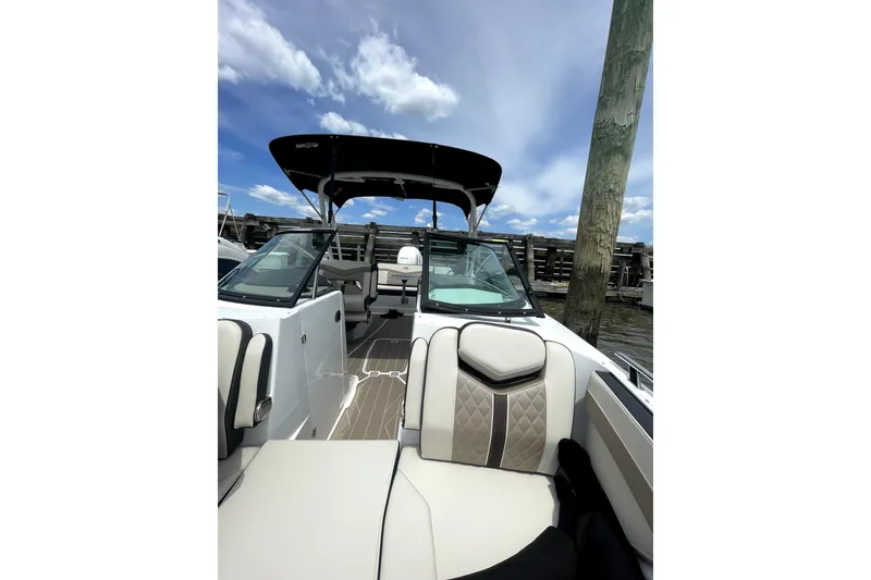 Slide: The Image of 2023 Monterey 275SS Super Sport boat interior with luxurious seating and sleek design. - 6