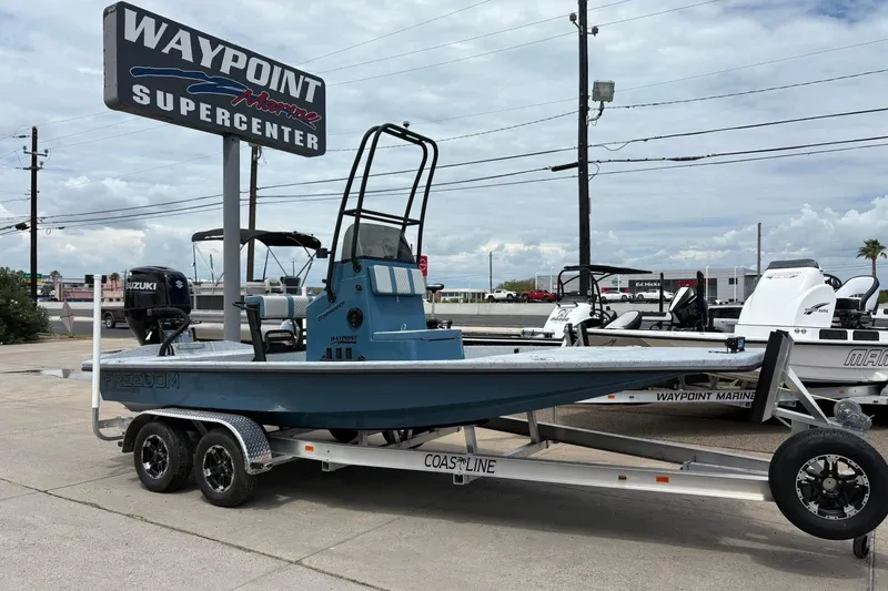 The Image of 2026 Freedom Boats 21' Commander on trailer at Waypoint Marine Supercenter. - 0