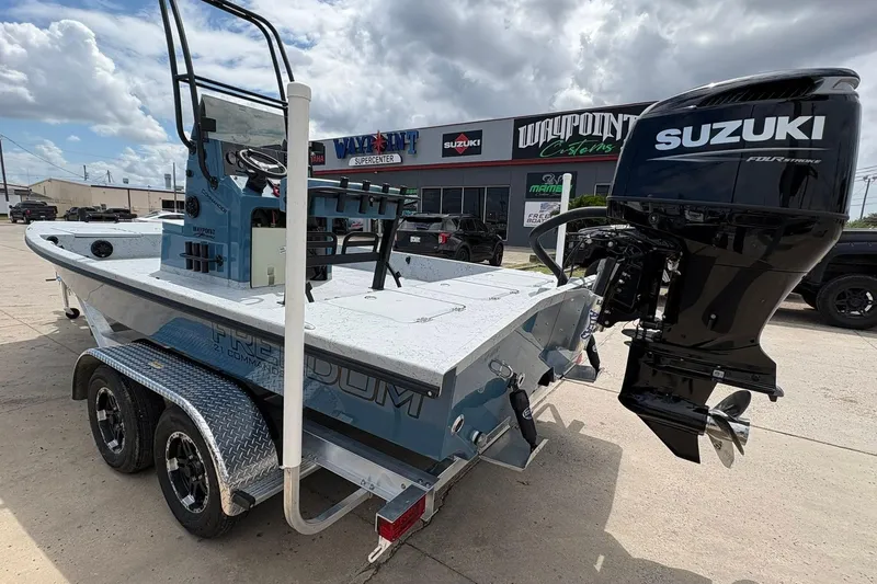 Slide: The Image of 2026 Freedom Boats 21' Commander with Suzuki outboard motor on trailer. - 14