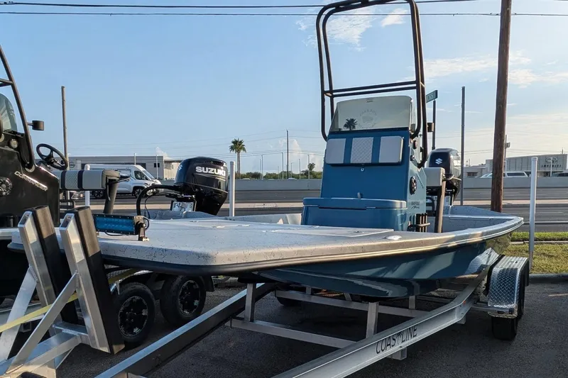 Slide: The Image of 2026 Freedom Boats 21' Commander on trailer, featuring Suzuki outboard motor. - 8