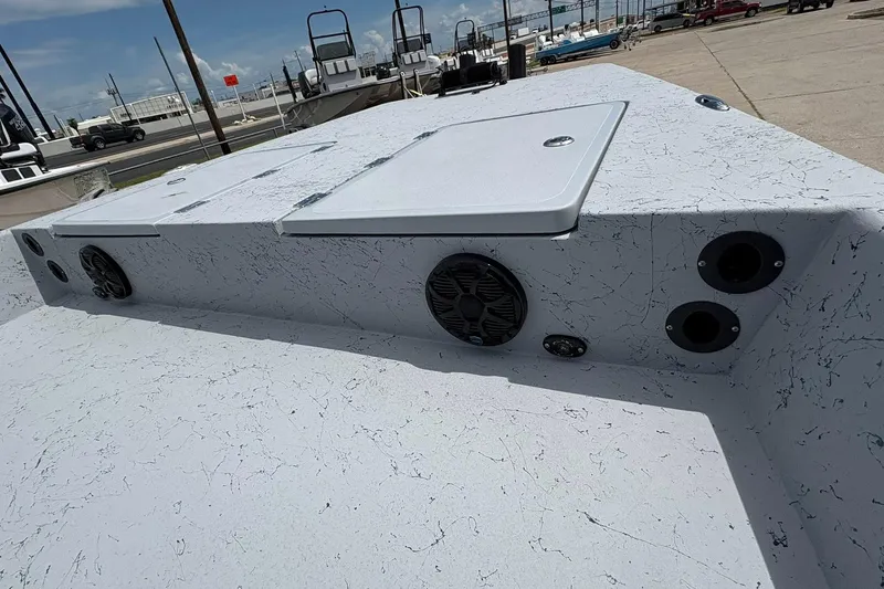 Slide: The Image of 2026 Freedom Boats 21' Commander deck with speakers and storage compartments. - 15