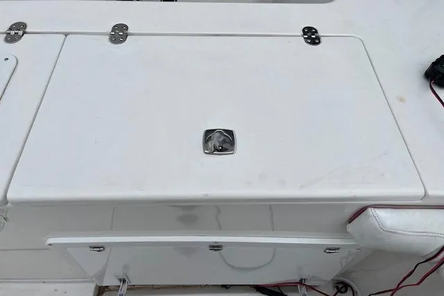 Slide: The Image of 2001 Fountain 38 Center Console boat deck with storage compartment. - 27