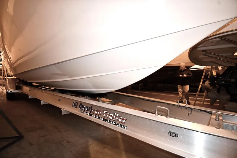 Slide: The Image of 2001 Fountain 38 Center Console boat on trailer in indoor storage facility. - 35