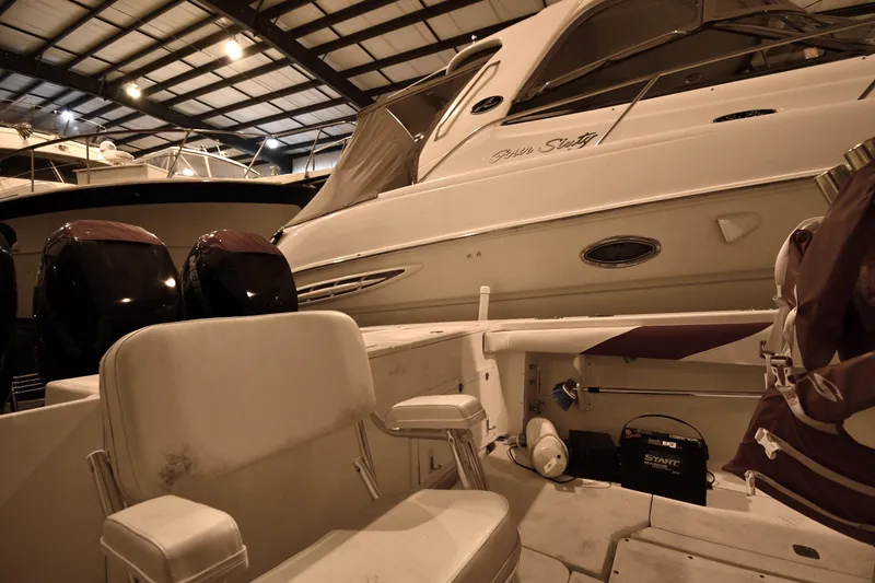 Slide: The Image of 2001 Fountain 38 Center Console boat in indoor storage with twin engines. - 50