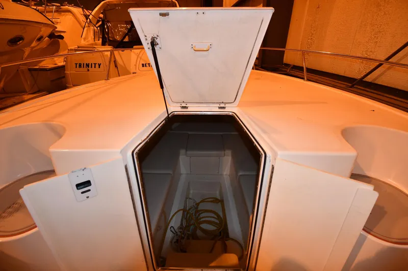 Slide: The Image of 2001 Fountain 38 Center Console boat with open storage compartment. - 57