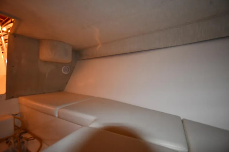 Slide: The Image of 2001 Fountain 38 Center Console cabin interior with cushioned seating. - 61