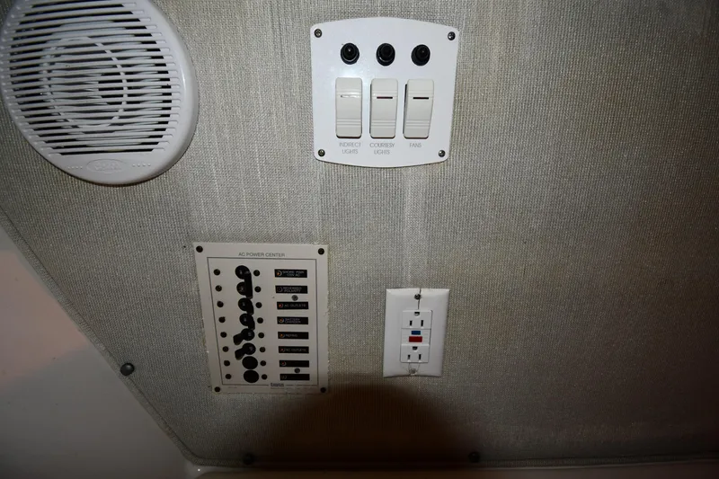 Slide: The Image of 2001 Fountain 38 Center Console interior with control panel and speaker. - 63