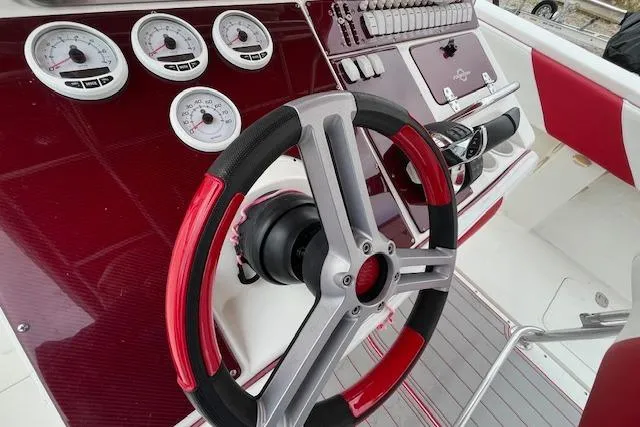 Slide: The Image of Steering wheel and gauges of 2001 Fountain 38 Center Console boat. - 7