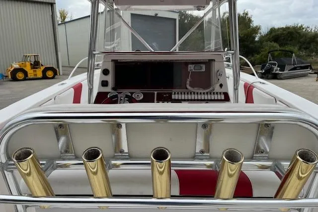 Slide: The Image of 2001 Fountain 38 Center Console boat with rod holders and control panel. - 8