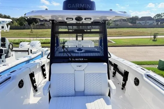 Slide: The Image of 2026 Tidewater 302 CC Adventure boat with Garmin navigation, featuring sleek seating and modern design. - 15