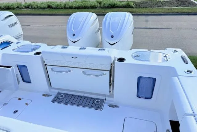 Slide: The Image of 2026 Tidewater 302 CC Adventure boat with dual Yamaha engines, featuring a sleek deck design. - 6