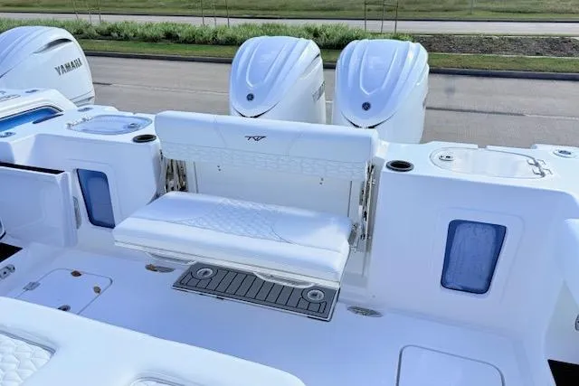 Slide: The Image of 2026 Tidewater 302 CC Adventure boat with Yamaha engines and seating area. - 7