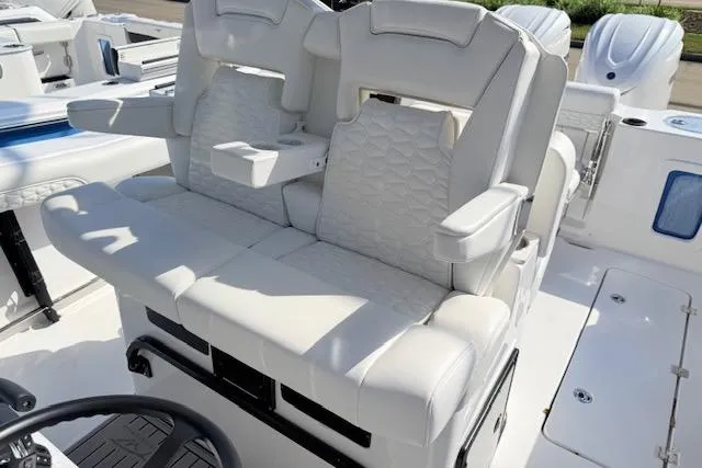 Slide: The Image of 2026 Tidewater 302 CC Adventure boat with luxurious white seating and armrests. - 9