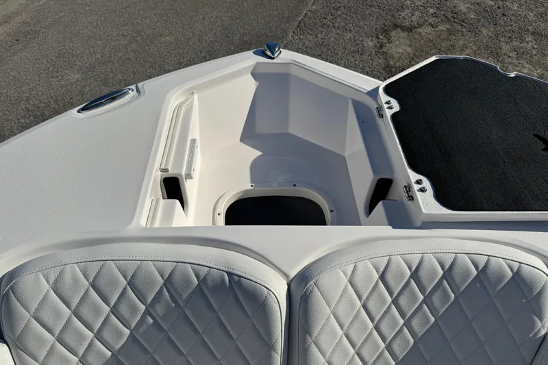 Slide: The Image of 2026 Sea Fox 228 Commander boat interior with quilted seating and storage compartment. - 11