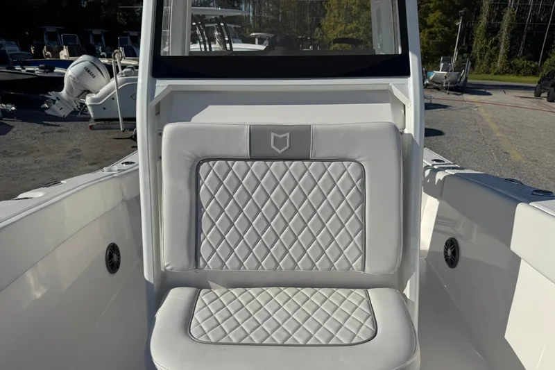 Slide: The Image of 2026 Sea Fox 228 Commander boat interior with diamond-stitched seating. - 12